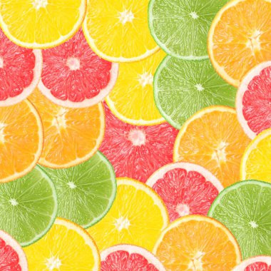 Arka plan olarak turunçgiller, üst manzara. Portakal, greyfurt, limon ve limon dilimleri.