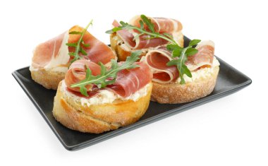 Krem peynirli, jambonlu ve roka soslu nefis bruschettalar.