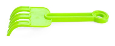 Plastik tırmık beyazda izole edilmiş. Çocukların plaj oyuncağı.