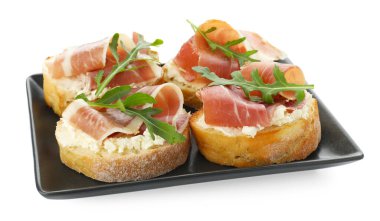 Krem peynirli, jambonlu ve roka soslu nefis bruschettalar.