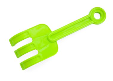 Plastik tırmık beyazda izole edilmiş, üst manzara. Çocukların plaj oyuncağı.