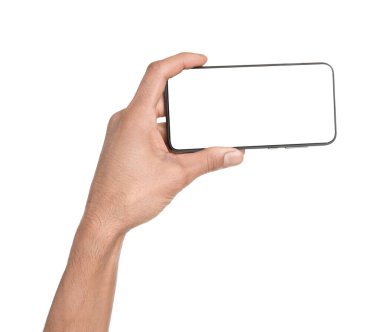 Man holding smartphone with blank screen on white background, closeup. Mockup for design