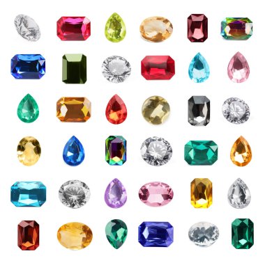 Beyaz üzerine izole edilmiş parlak değerli taşlar.