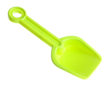 Açık yeşil plastik kürek beyaza izole edilmiş. Çocukların plaj oyuncağı.