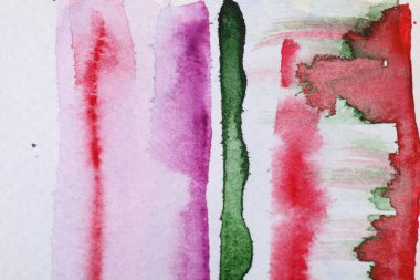 Abstract colorful watercolor painting on white paper, top view