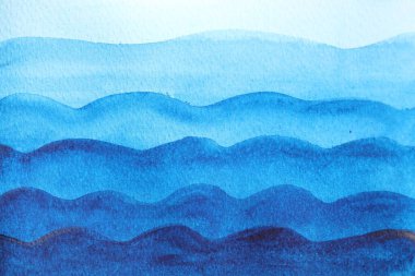 Abstract blue watercolor painting on white paper, top view