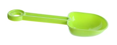 Açık yeşil plastik kürek beyaza izole edilmiş. Çocukların plaj oyuncağı.