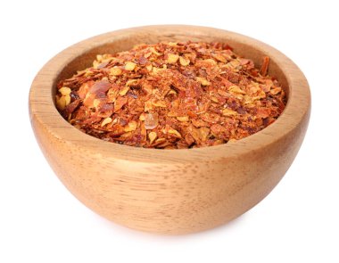 Kırmızı biber taneleri beyaz kasede izole edilmiş.