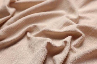Arkaplan olarak bej kumaşın dokusu, yakın plan