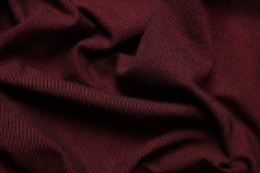 Arka plan olarak kaliteli bordo kumaş dokusu, üst görünüm