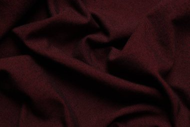 Arka plan olarak kaliteli bordo kumaş dokusu, üst görünüm