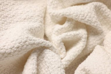 Arka plan olarak temiz bej kumaşın dokusu, üst görünüm