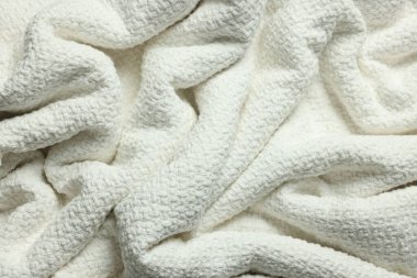 Arkaplan olarak temiz beyaz kumaşın dokusu, üst görünüm