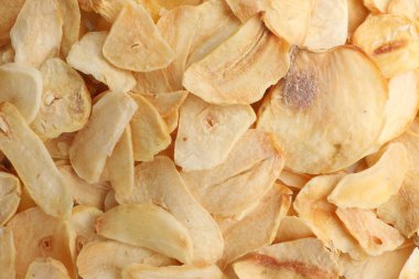 Arka plan olarak kurutulmuş sarımsak taneleri, üst görünüm