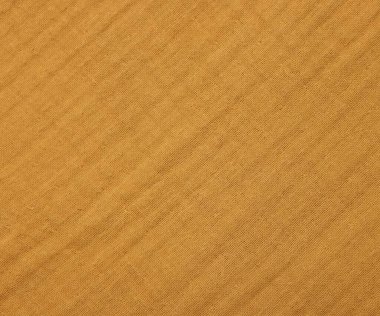 Arkaplan olarak parlak turuncu kumaşın dokusu, üst görünüm