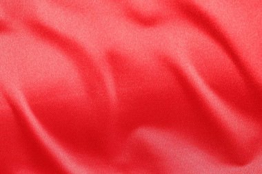 Arka plan olarak kırmızı kumaşın dokusu, üst görünüm