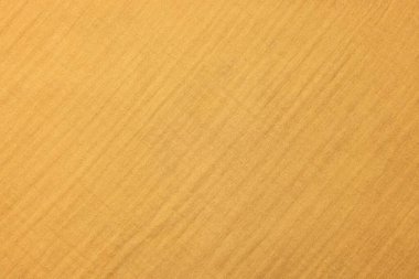 Arkaplan olarak parlak turuncu kumaşın dokusu, üst görünüm