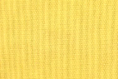 Arkaplan olarak sarı kumaşın dokusu, üst görünüm