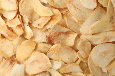 Arka plan olarak kurutulmuş sarımsak taneleri, üst görünüm