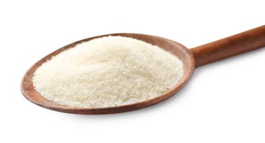 Beyaz kaşık içinde kuru jelatin tozu.