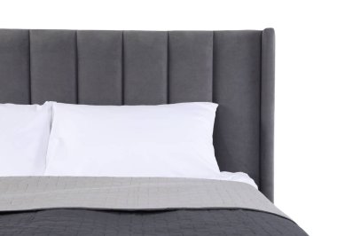 Gri battaniyeli yatak ve beyaz yastıklı