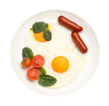 Yağda yumurta, sosis, ıspanak ve domatesli nefis bir kahvaltı.