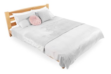 Beyaz çarşaflı büyük bir yatak.