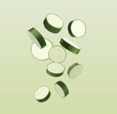 Kabak parçaları yeşil gradyan arka plana düşüyor