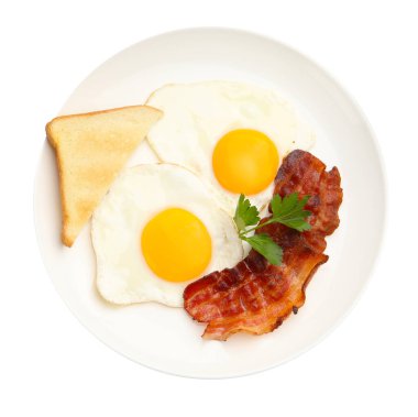 Yağda yumurta, domuz pastırması, maydanoz ve ekmek dilimleri ile nefis bir kahvaltı.