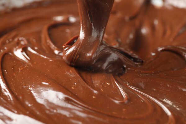 Closeup view of flowing delicious melted chocolate