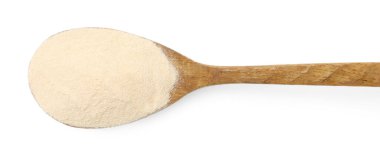 Tahta kaşıkta jelatin tozu. Beyaz, üst manzara.