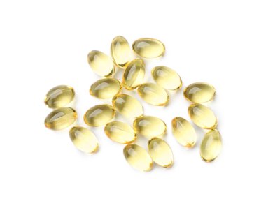 Altın jelatin kapsül yığını beyaz, üst görünümde izole