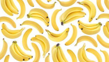 Beyaz arka planda havada uçuşan taze muzlar