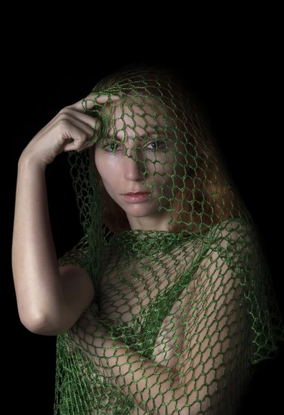Woman posing caught in the net and thinking — Stock Photo, Image