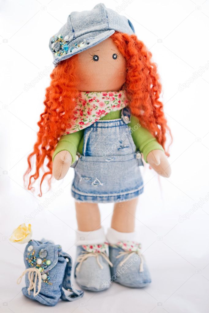 Red-haired doll handmade dressed in jeans 