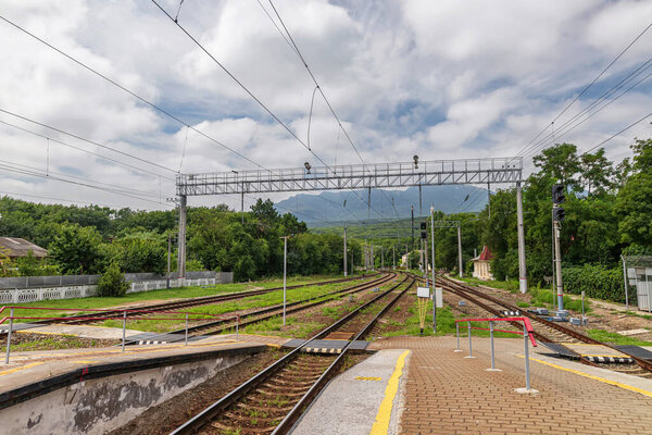 Railway tracks and rails at an old station in a mountainous area