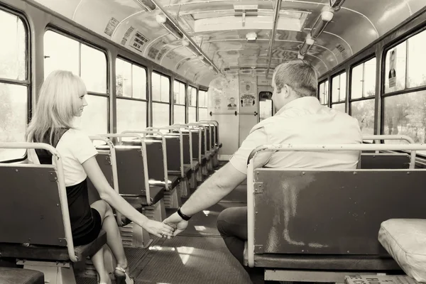 Young guy to get acquainted with a cute girl in the tram — Stock Photo, Image