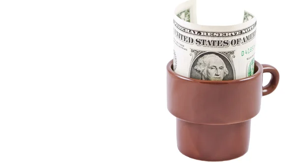Dollar in a coffee Cup left as a tip — Stock Photo, Image
