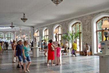 Tourists in Narzan gallery of Kislovodsk clipart