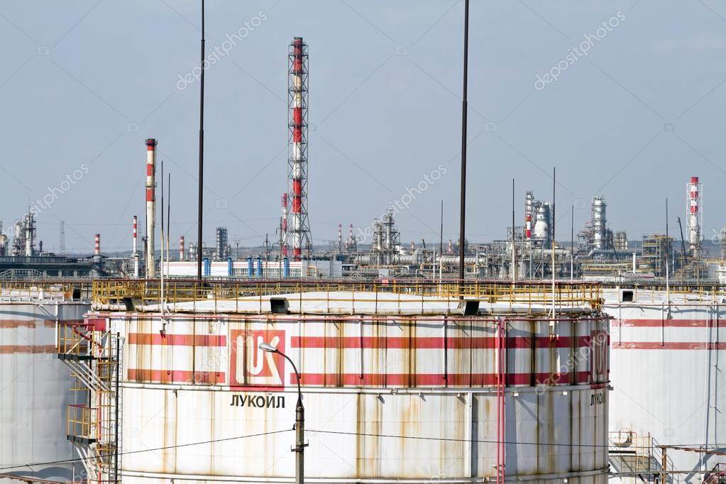 VOLGOGRAD, RUSSIA - AUGUST 28: Huge storage tanks for petroleum products with the logo of LUKOIL on the background of a large refinery . August 28, 2015 in Volgograd, Russia.