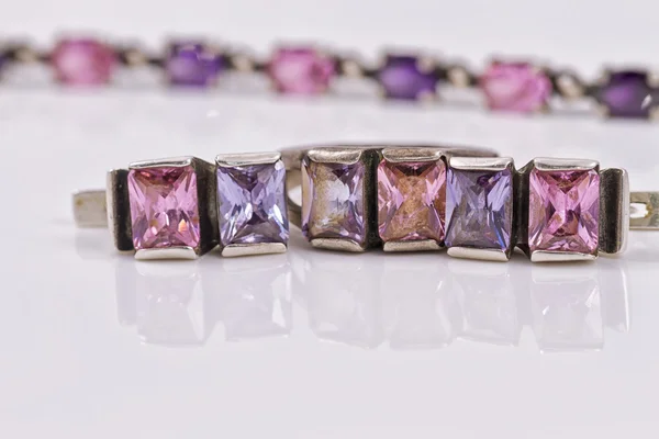 A set of silver jewelry with purple gem stones — Stock Photo, Image