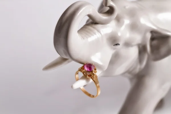 Porcelain figurine of an elephant with a silver ring — Stock Photo, Image