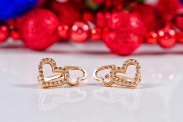Gifts for new year - Golden earrings — Stock Photo, Image