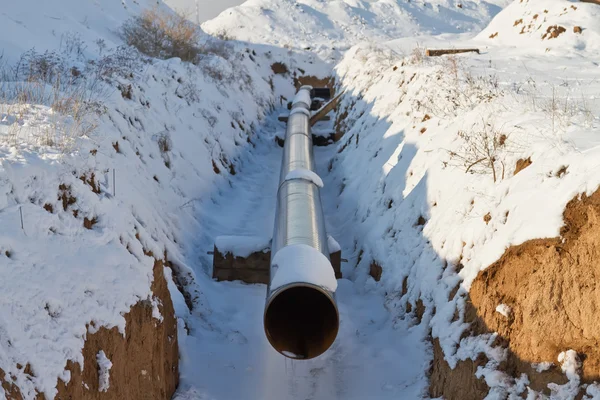 Pipeline laying in polymeric insulation in a trench dug — Stock Photo, Image