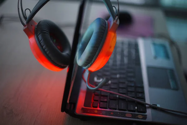 Headphones have a red light and computer