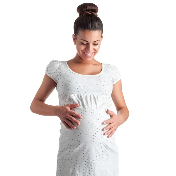 Cute pregnant girl in white dress in polka dots — Stock Photo, Image