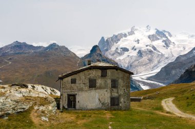 House and lodge cabin in the Alps on the route to the Matterhorn.