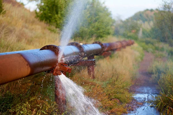 Leakage of water from an industrial water pipe.