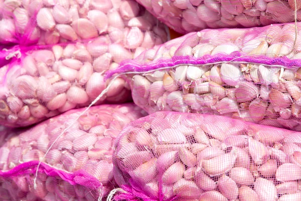 Bags of garlic in the market — Stock Photo, Image