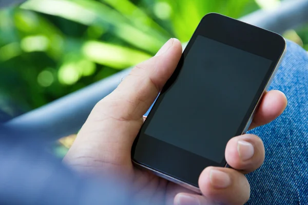 Man hand holding a smart phone — Stock Photo, Image